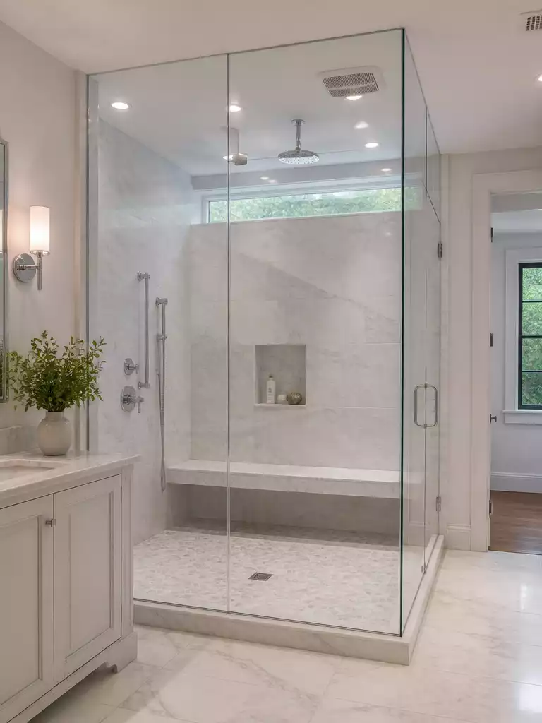 Floor-to-Ceiling Glass shower doors for a high-end luxury steam room feel