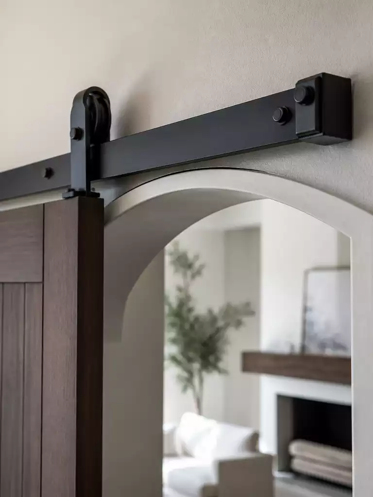 WHY ARCHED OPENINGS COMPLICATE A BARN DOOR